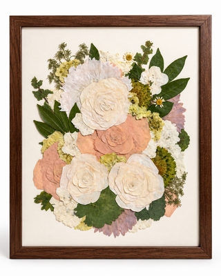 Image of a pressed wedding bouquet in a custom wood frame.