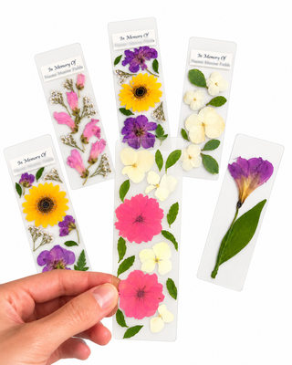 Personalized pressed floral bookmark created as a keepsake from meaningful flowers