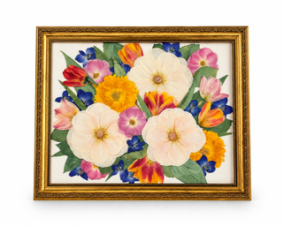 Custom pressed wedding bouquet featuring cream, pink, yellow, red, and blue flowers with green foliage in an ornate vintage gold frame by Forgiven Flower.
