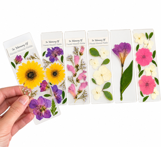 lose-up of handmade pressed flower bookmarks with delicate preserved blooms